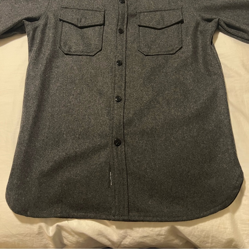 Size small Grey men’s wool jacket.  Excellent condition. Hardly worn